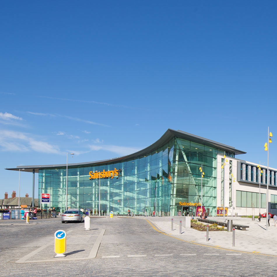 A 120.000 sq ft fully glazed supermarket in the heart of the Talbot Gateway provides a striking entrance for visitors to the area, as well as offering a major town centre superstore. In addition to the 58,000 sqft of retail space, the store also offers Argos Click and Collect, Tu clothing range, in store bakery, hot food and pizza counter. Parking is available across two levels above the store, with a petrol station opposite.